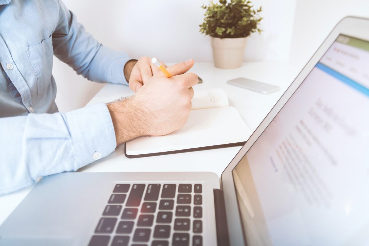 A business man writing down notes